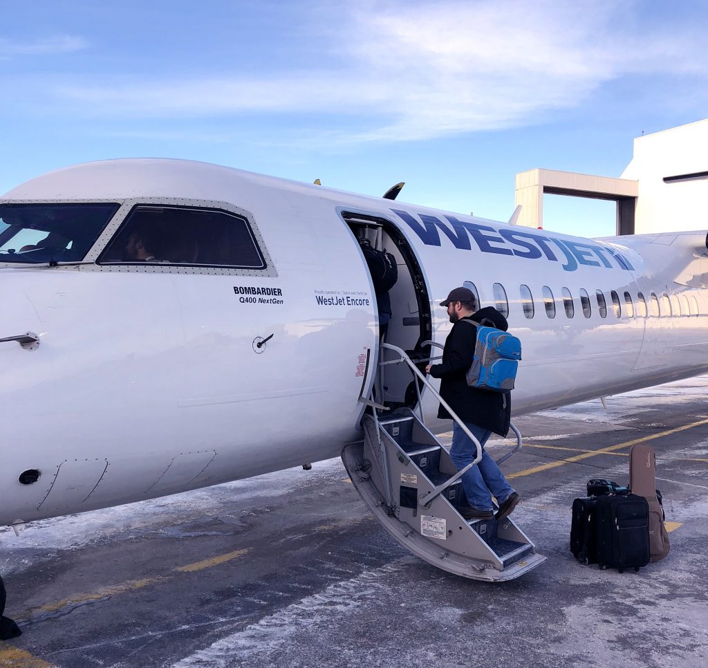 Walking on the tarmac to board our flight.