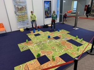 A game of Carcassonne played with tiles measuring two feet square