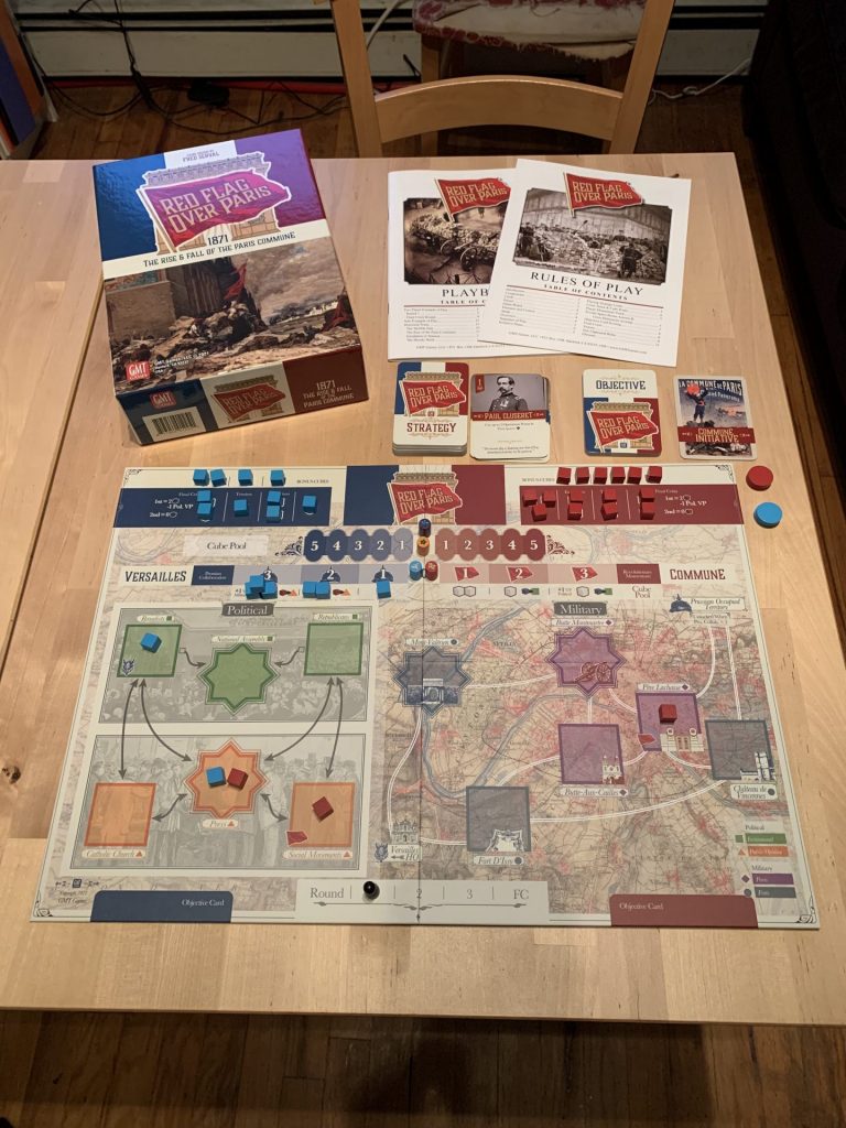A picture of the components laid out on the table with the box and manual.