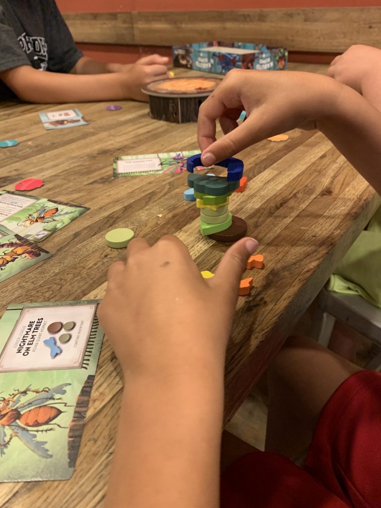 A child stacking pieces in a tower