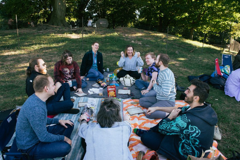 The photograph shows a group of my friends sitting in a circle in Prospect Park.