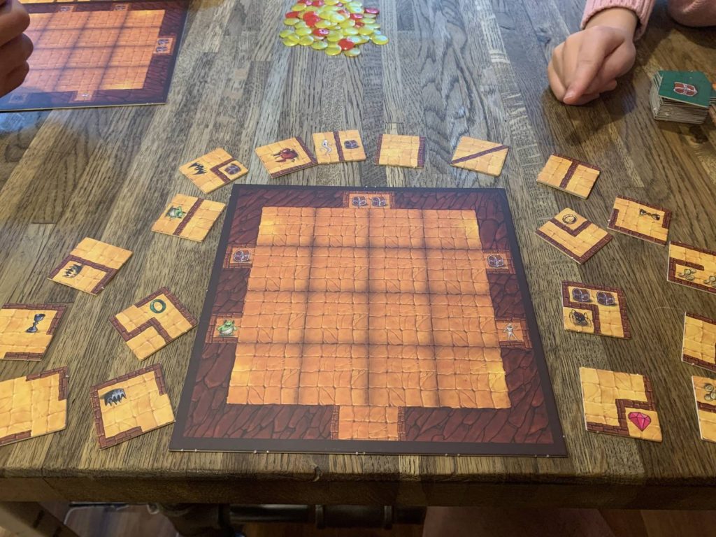 An empty player board surround by face-up tiles, as a player would see at the start of the game.