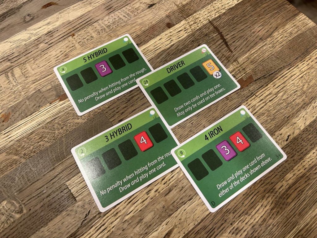 Four golf club cards