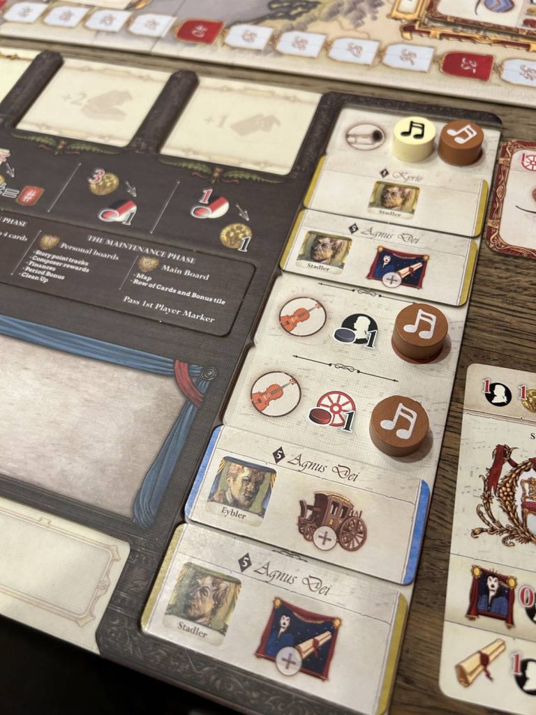 Several upgrade tokens slotted into the right side of the player board.