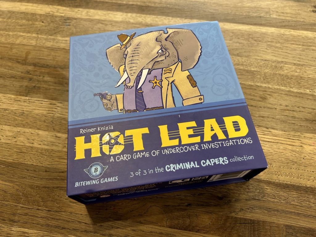 The box for Hot Lead, depicting a police detective elephant holding a gun.