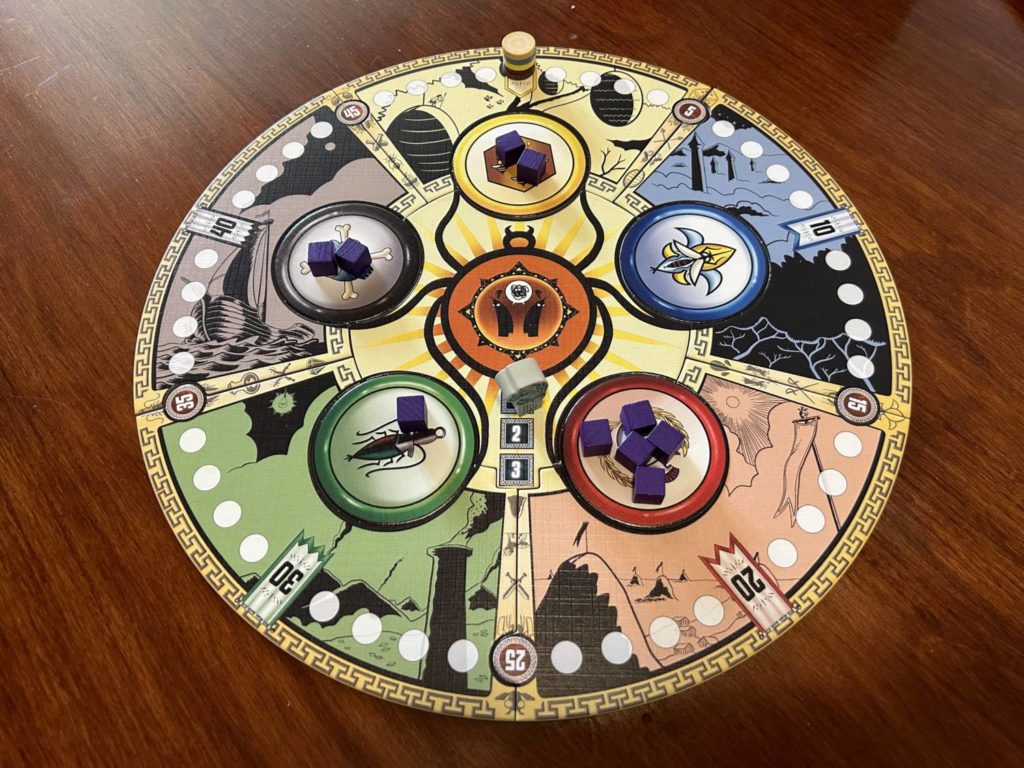 The board for Bug Council of Backyardia is round, divided into five sections. Each section corresponds to one of the five suits. A score board runs around the outer edge.