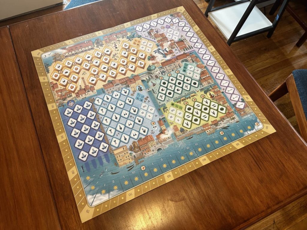 An overhead shot of the empty board, which is divided into six different colors, representing five separate areas. There is a sea lane to the southern edge of the board.