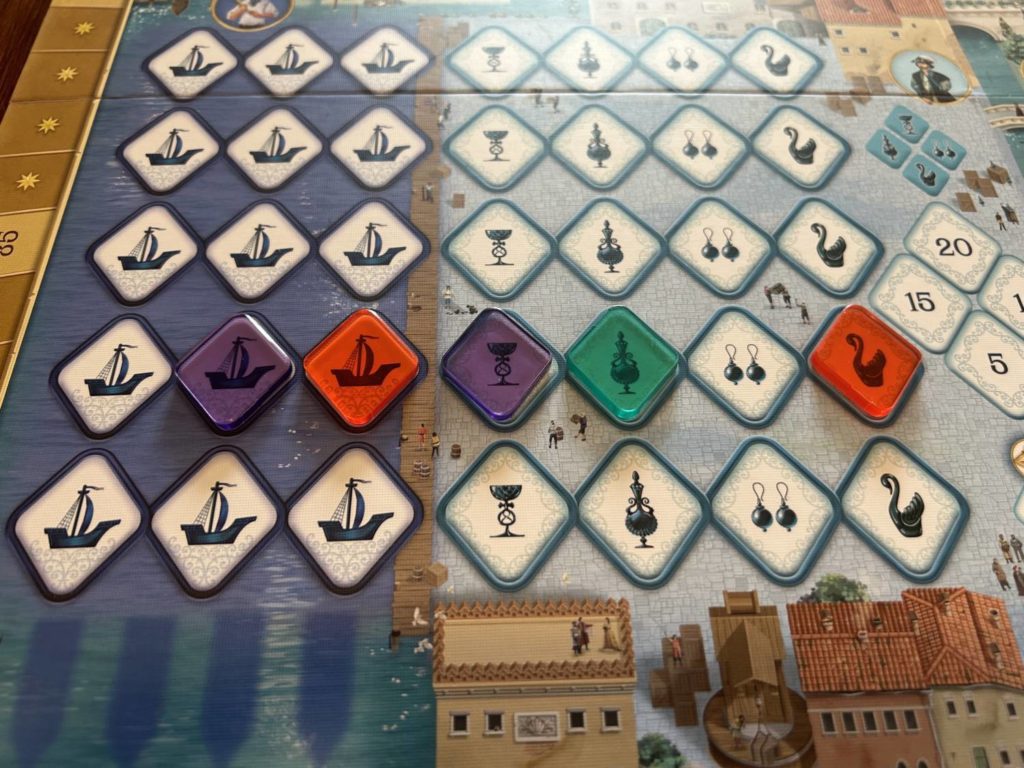 A purple and ride tile sit in the Harbor next to three Traders tiles.