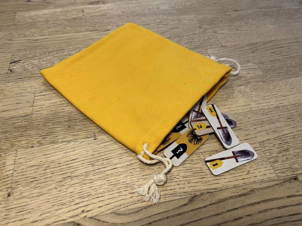 A drawstring bag made of heavy cloth, in bold yellow.