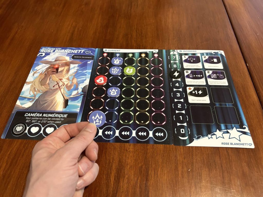 A board mid-game, with only three slots left in the blue column. I'm holding a bullet with a 4 on it.