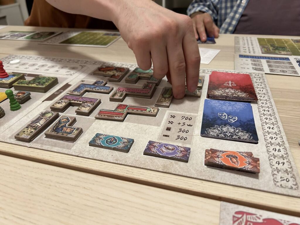 A player chooses one of the buildings available to add to their player board.