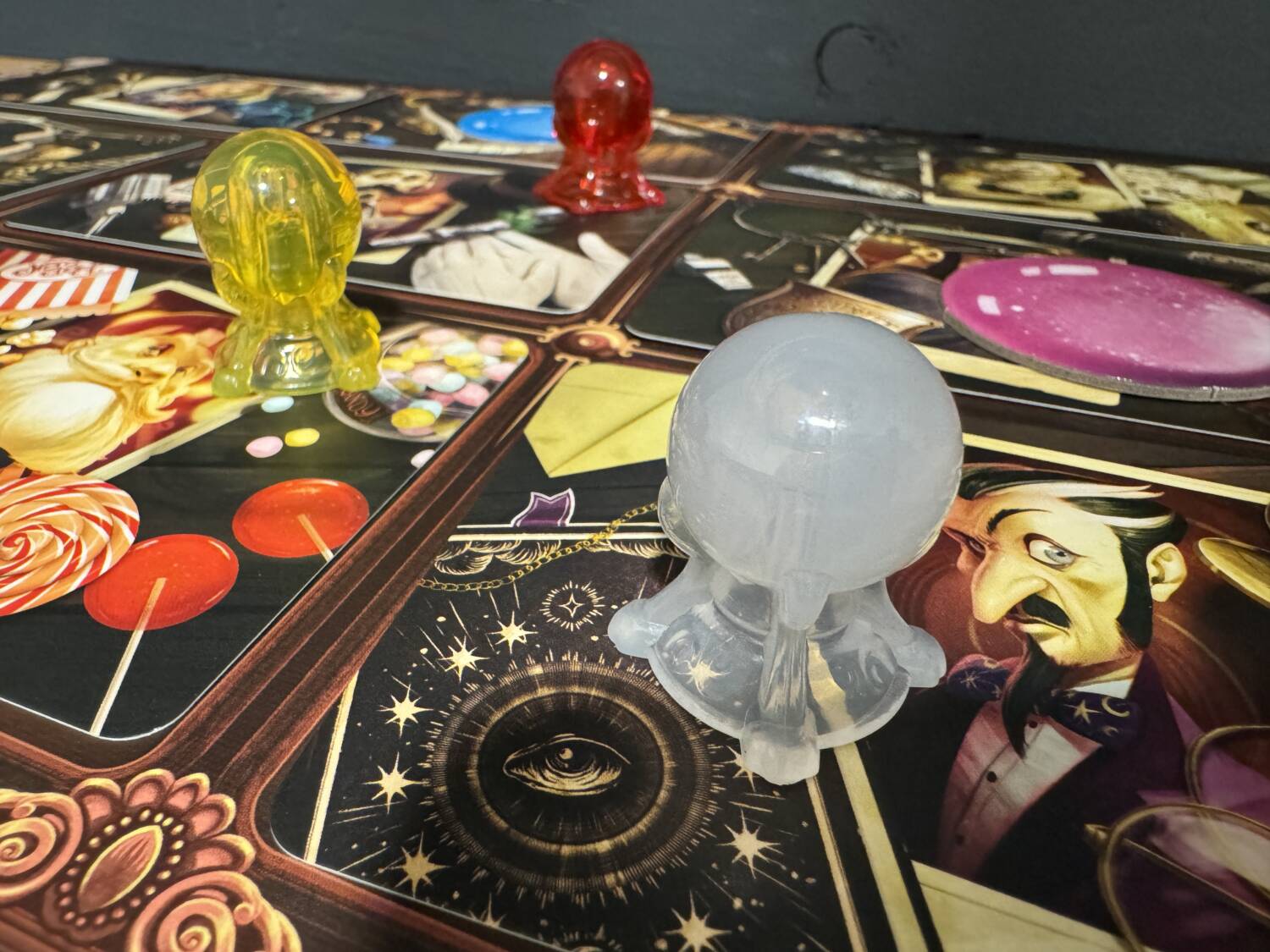 The crystal ball player pawns for the Mysterium Park board game.