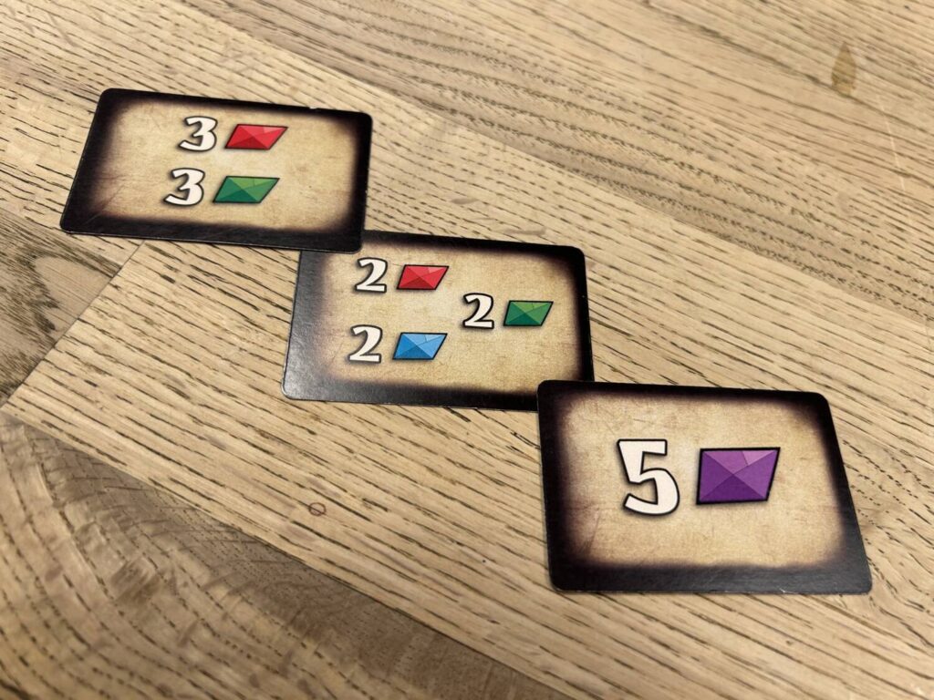 Three of the player goal cards.