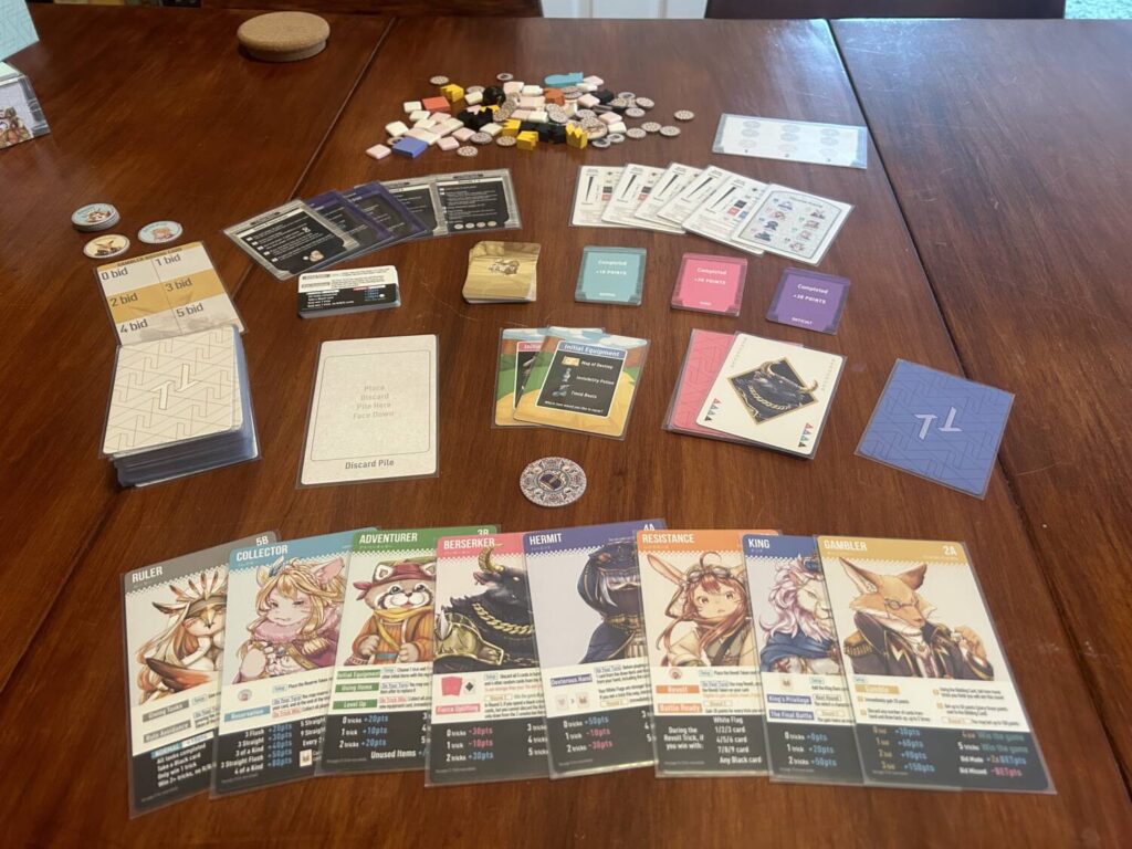 A table full of various decks in different sizes, a smattering of tokens of all varieties, and oversized character cards.