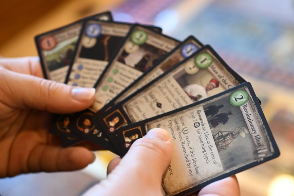 A player looks through their hand of cards.