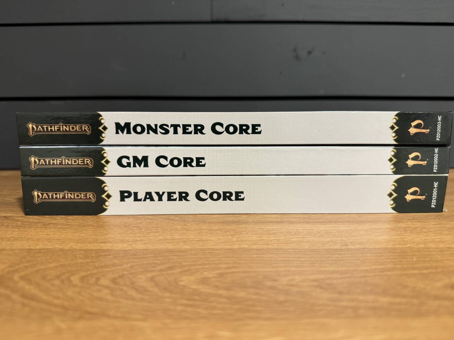 Side binding of the three Pathfinder Core books: Monster Core, GM Core, and Player Core.