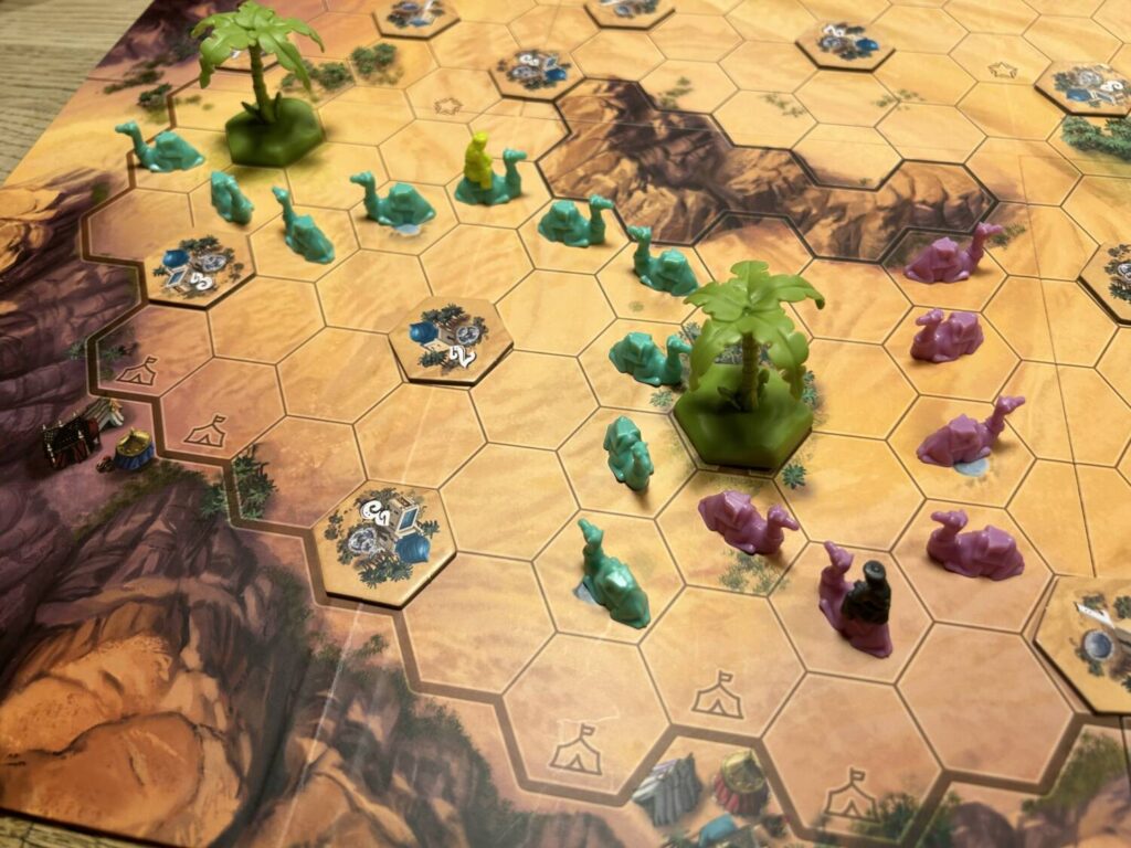 A portion of the board during a game, showing two caravans of camels.