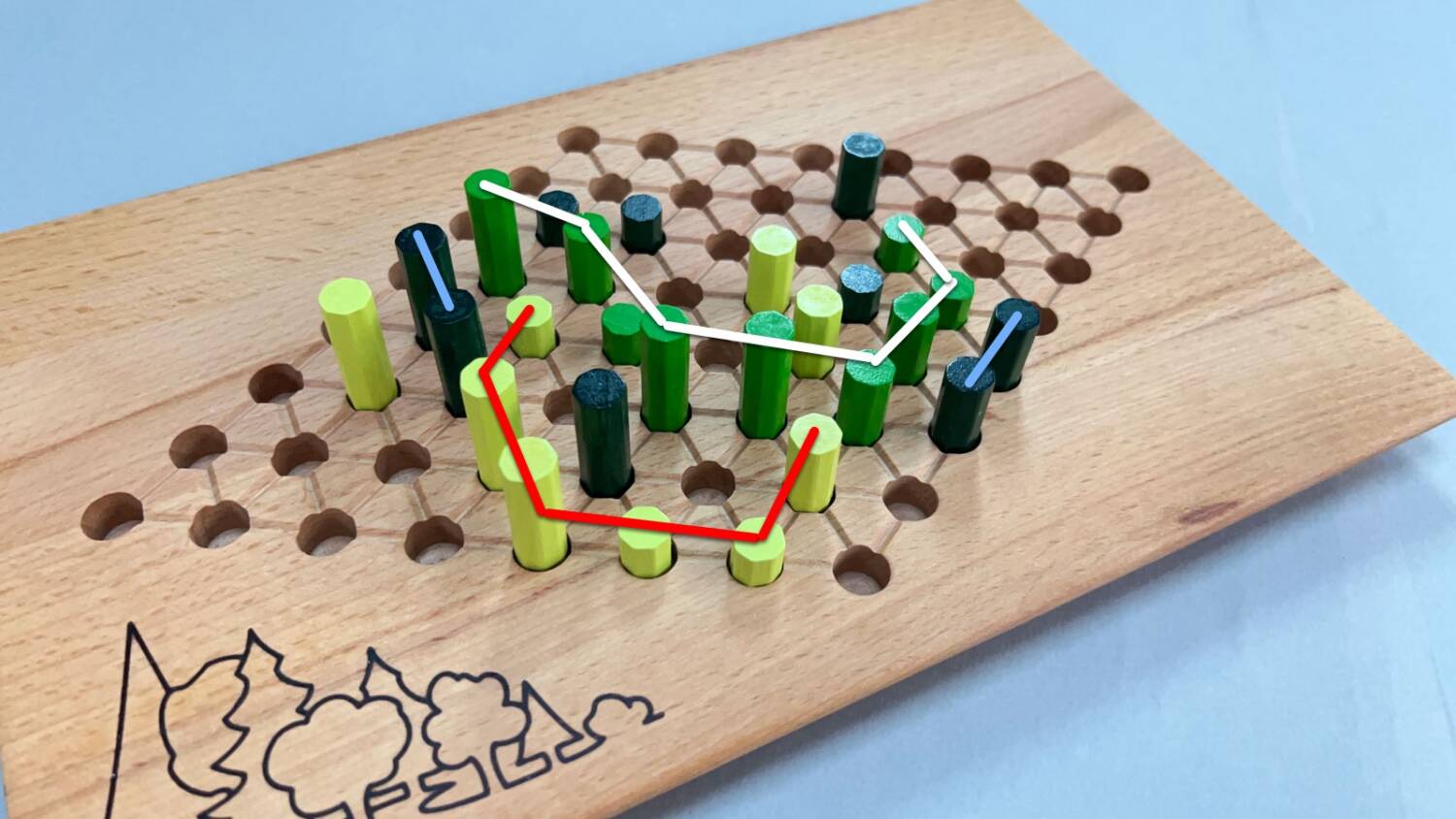The light green pieces are connected by the red line; the Kelly green by the white line; the two dark green (both only scoring two points) by the light blue line.