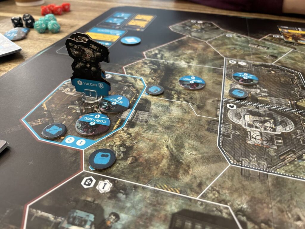 Another shot of a mech on the board, with a large number of blue units nearby.