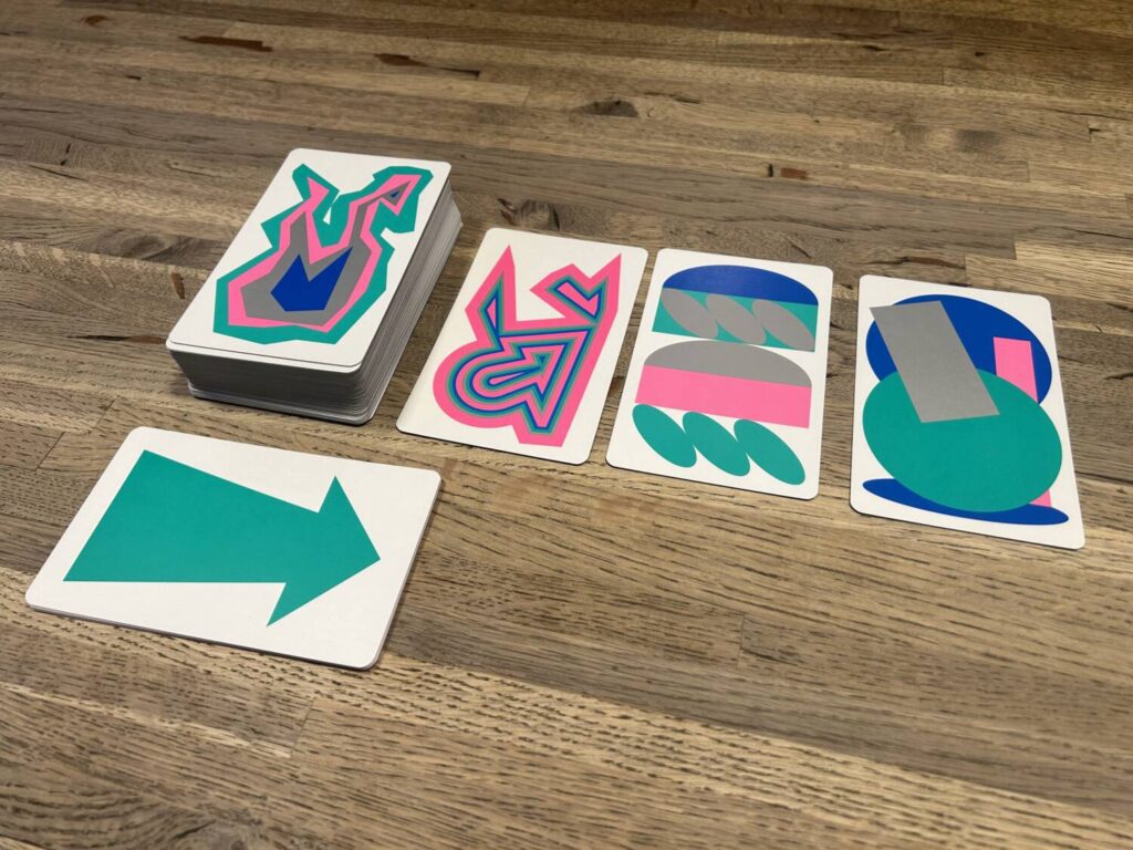 Four of the cards for Figment in a row, each showing a wildly abstract combination of overlapping shapes and colors.