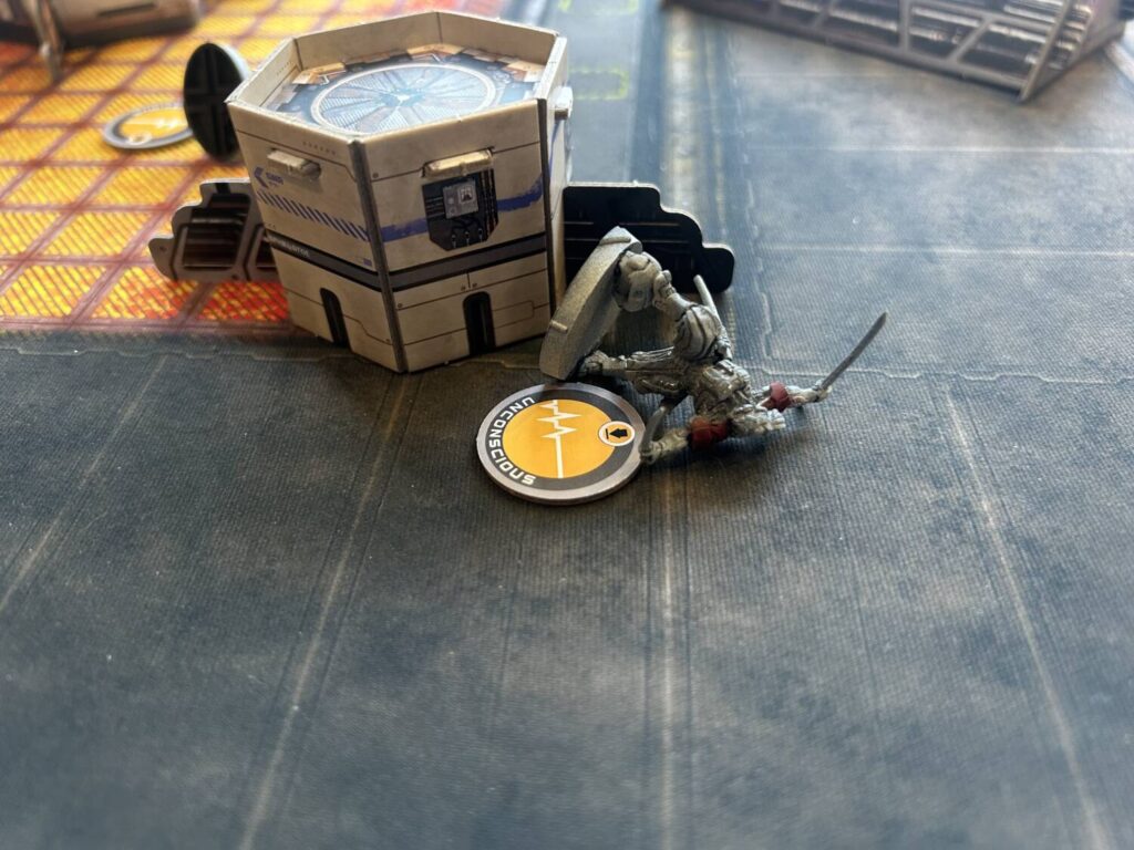 An incapacitated unit lays on its side.