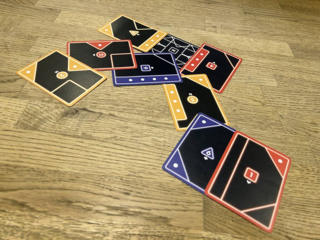 Overlapping cards on a wooden table.