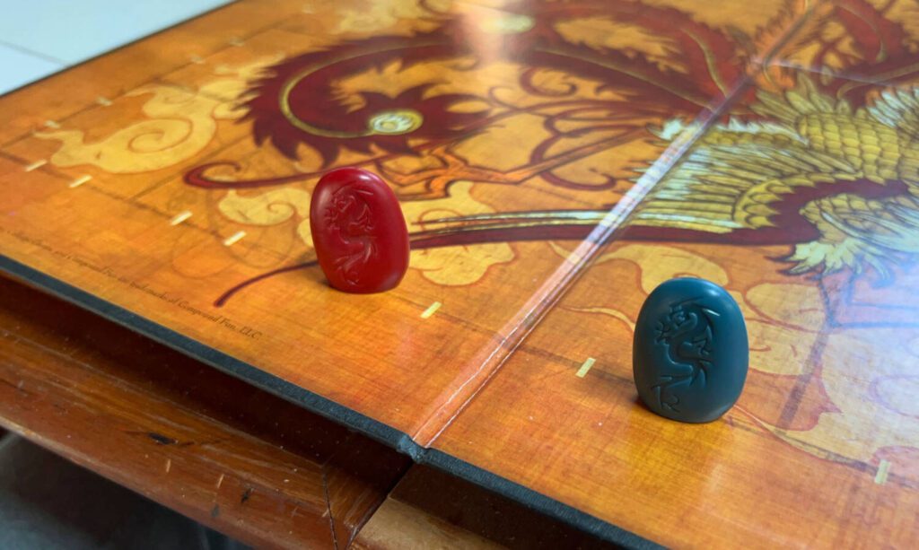 Two pieces in their starting positions on the board
