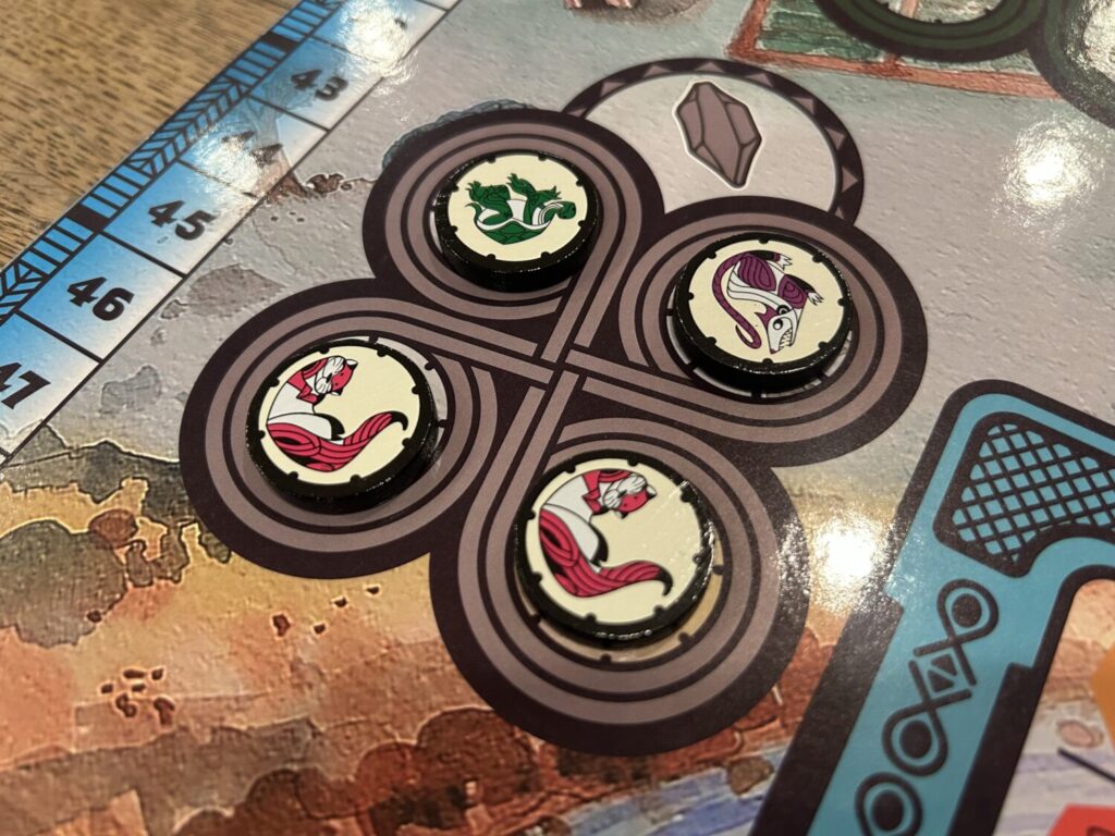 Four wooden character tokens sit in the four worker spaces available for the stone resource.