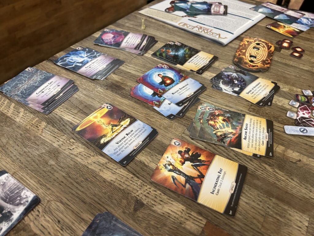 A card market with nine cards on a wooden table.