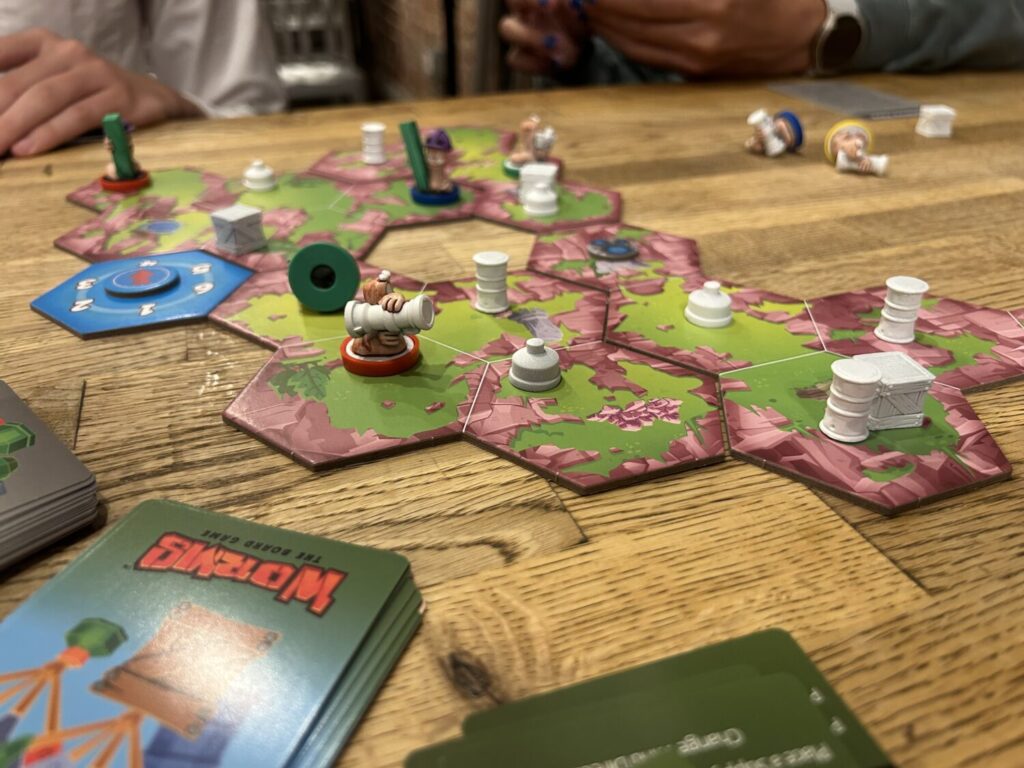 A medium shot of the same board. Decks of cards can be seen on the table next to the board.