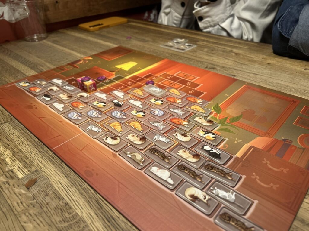 A wider photo the board, which is now nearly full of cat tiles.