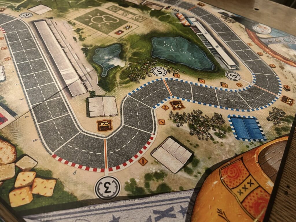 A board depicting a race track.