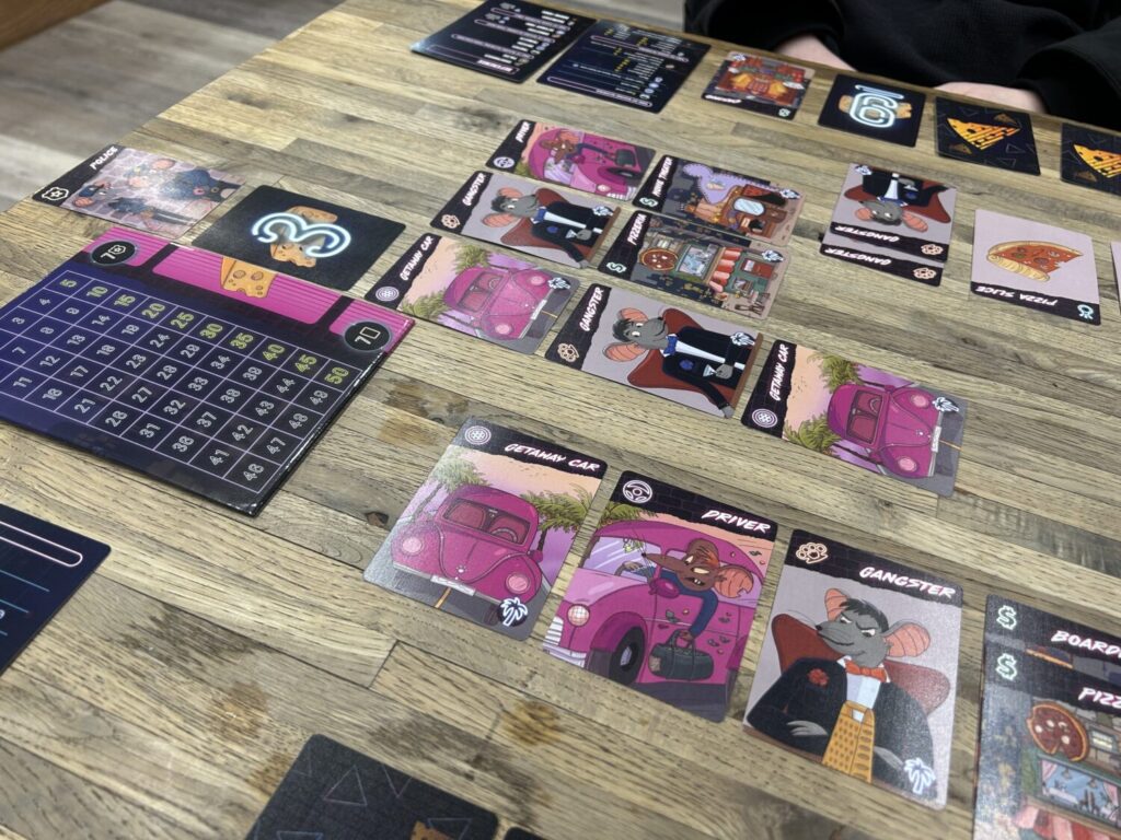 An uninterpretable mess of cards on a wooden table.