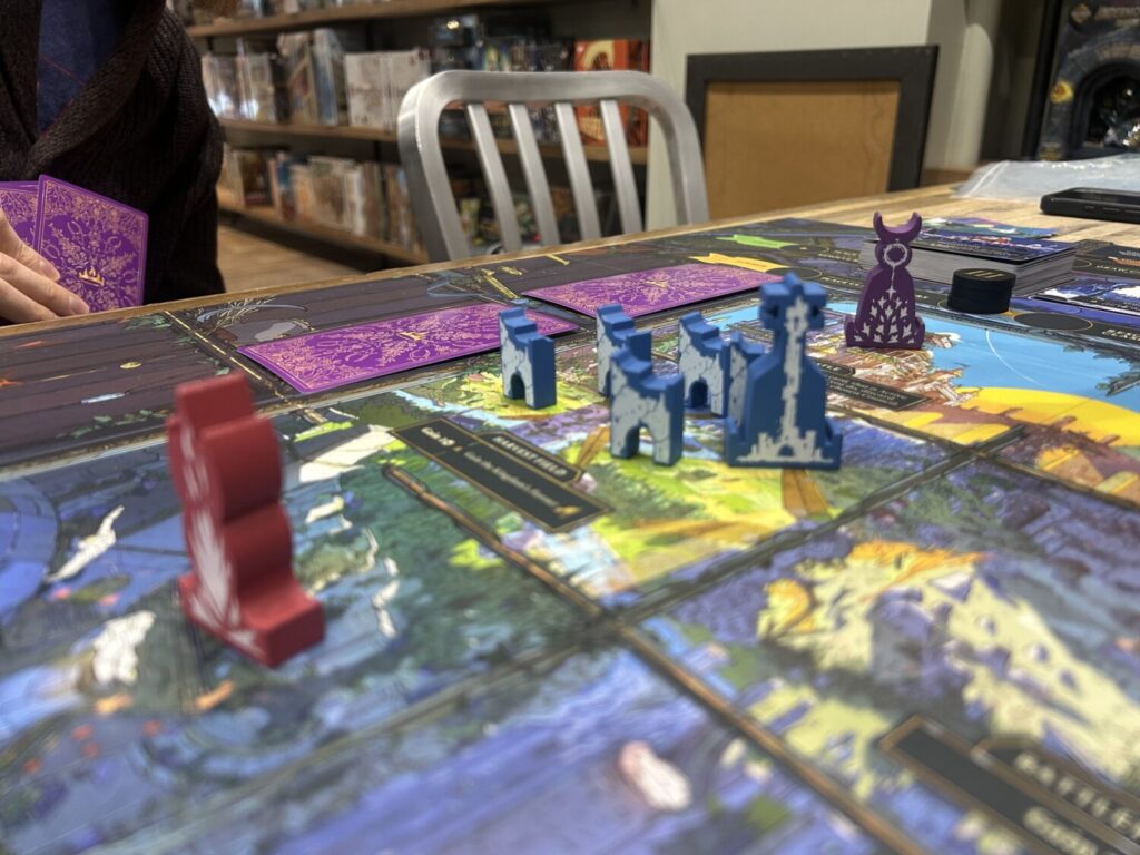 A closer photo of one pane on the board, which is full of wooden figures.