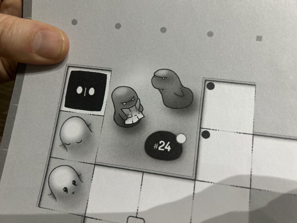 A charming drawing of two abstracted creatures looking in frustration at a map.