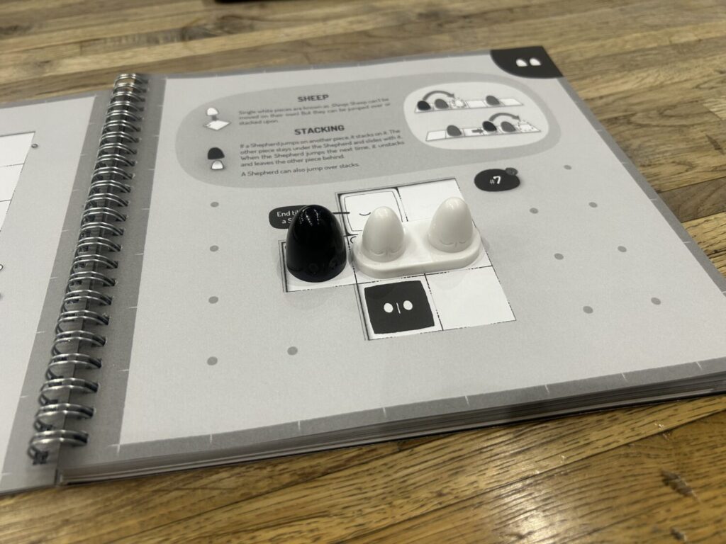 That lone conical piece is now joined by two smaller conjoined white pieces.