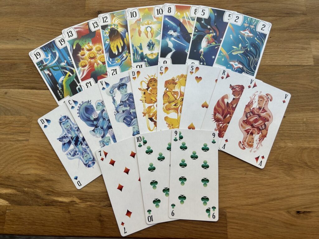 A splayed hand of French Tarot cards. The trumps are gorgeously illustrated.