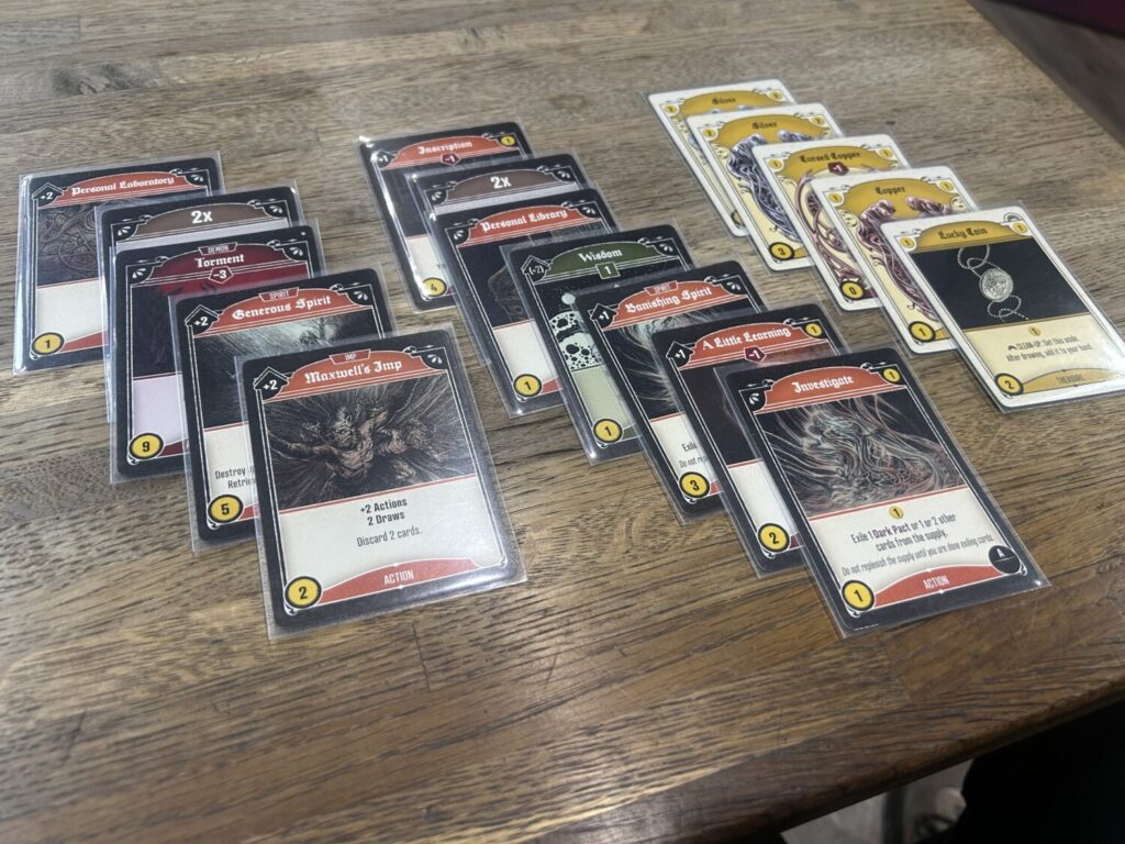 17 cards sit out on the table. It is all but one of the current player's deck.