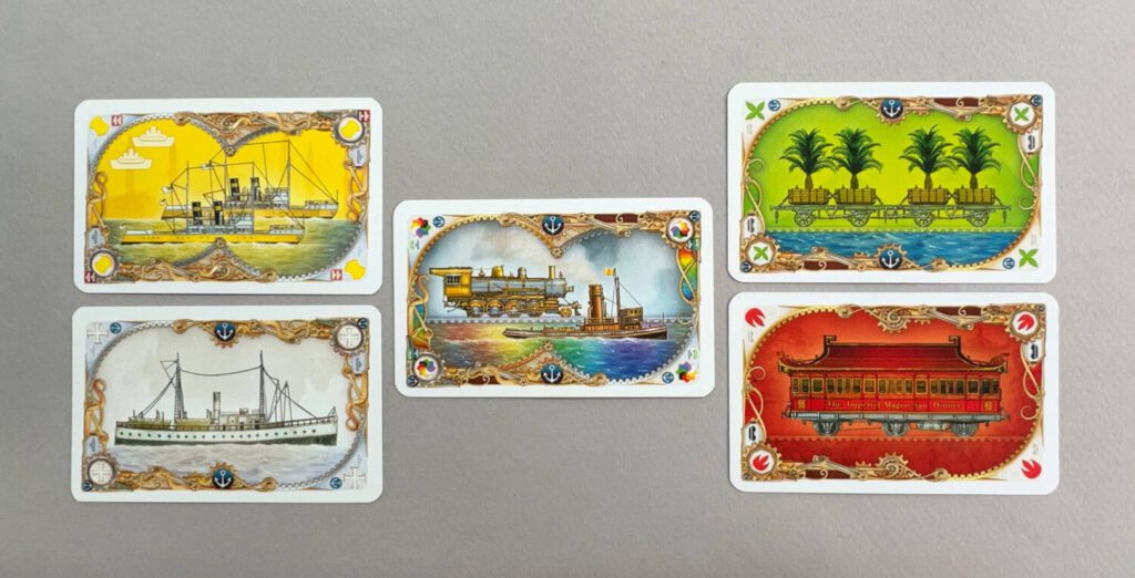 A double yellow boat, a single green train with an anchor showing it can be used when creating a harbor, red single train, single white boat with anchor, and a wild train/boat card with anchor.