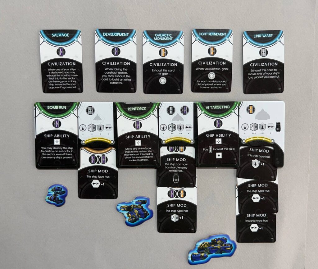 Top: Researched Civilization cards. Bottom: Researched Ship Abilities and Ship Mods. Note that each larger sized ship has one additional Ship Mod slot than the one before it. 